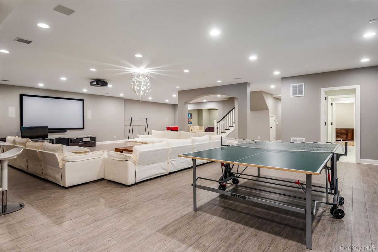 Game Room, Interior, Living room, Pendant Lights, Projection Screen, Recessed Lighting, Wood Texture Flooring