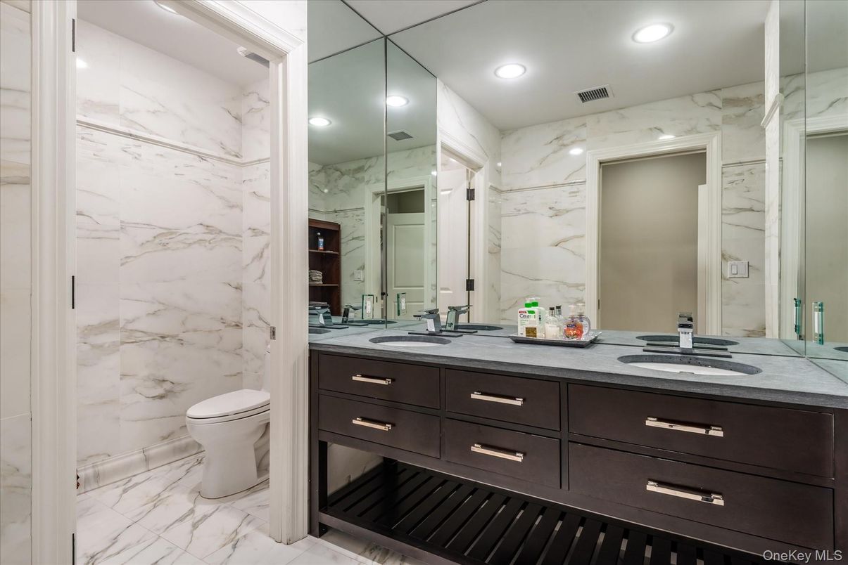 Bathroom, Dual Sink Vanities, Interior, Marble, Marble Walls, Recessed Lighting