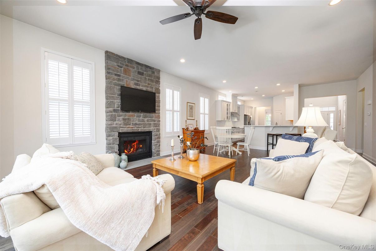 Dining room, Fireplace, Interior, Kitchen, Living room, Recessed Lighting, Stone Walls, Wood Texture Flooring