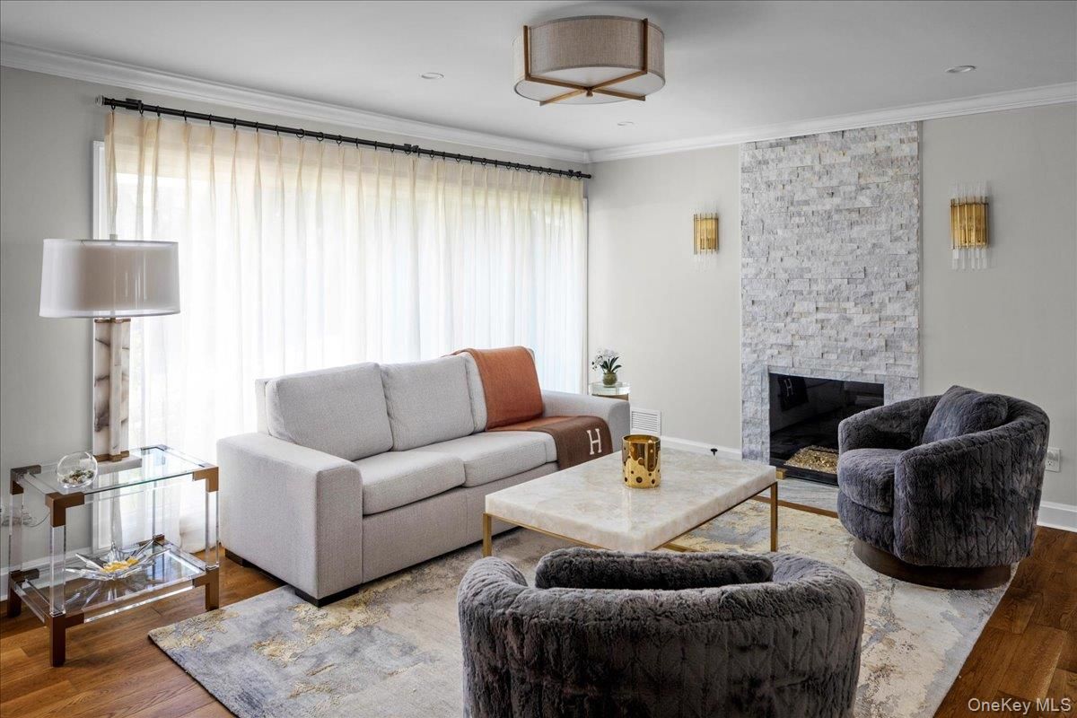 Fireplace, Interior, Living room, Recessed Lighting, Stone Walls, Wood Texture Flooring