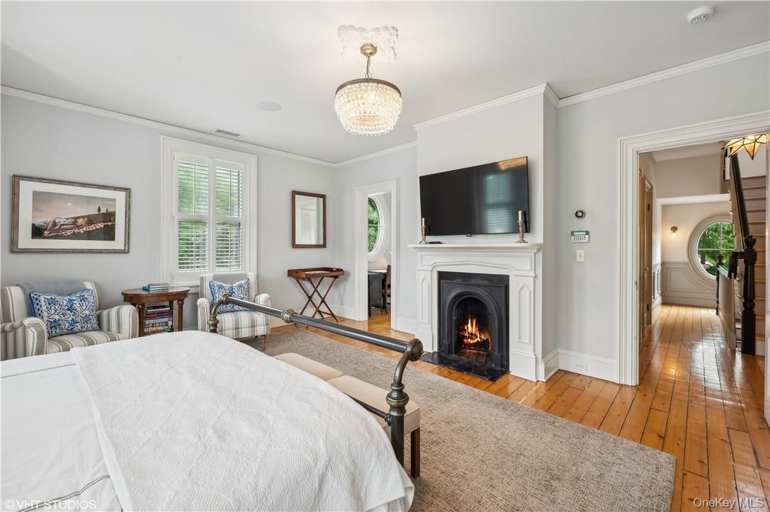 Bedroom, Chandelier, Fireplace, Interior, Wood Texture Flooring