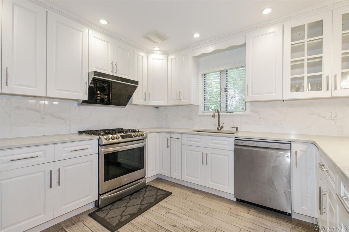Interior, Kitchen, Marble Walls, Recessed Lighting, Stainless Steel Appliances, Wood Texture Flooring