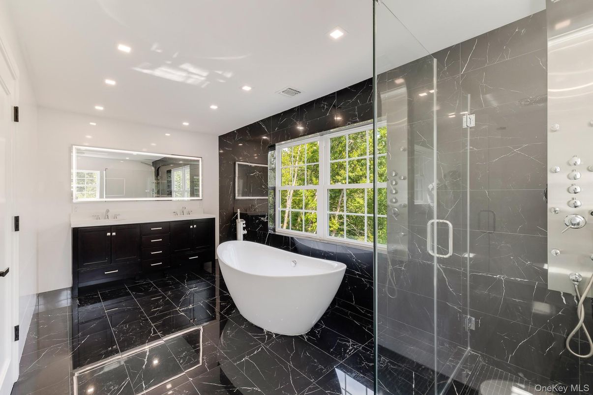 Bathroom, Dual Sink Vanities, Free Standing Baths, Glass Shower, Interior, Marble, Marble Walls, Recessed Lighting