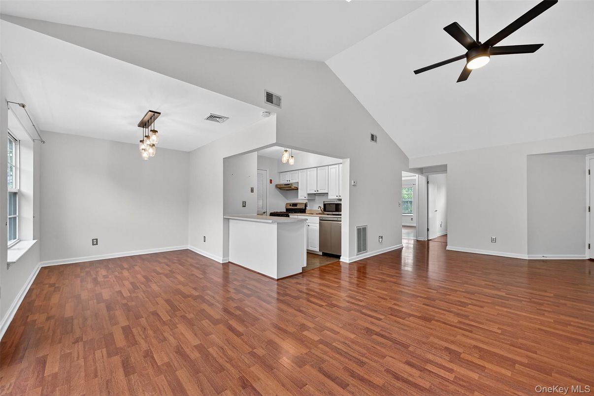 Empty room, Interior, Kitchen, Pendant Lights, Stainless Steel Appliances, Wood Texture Flooring