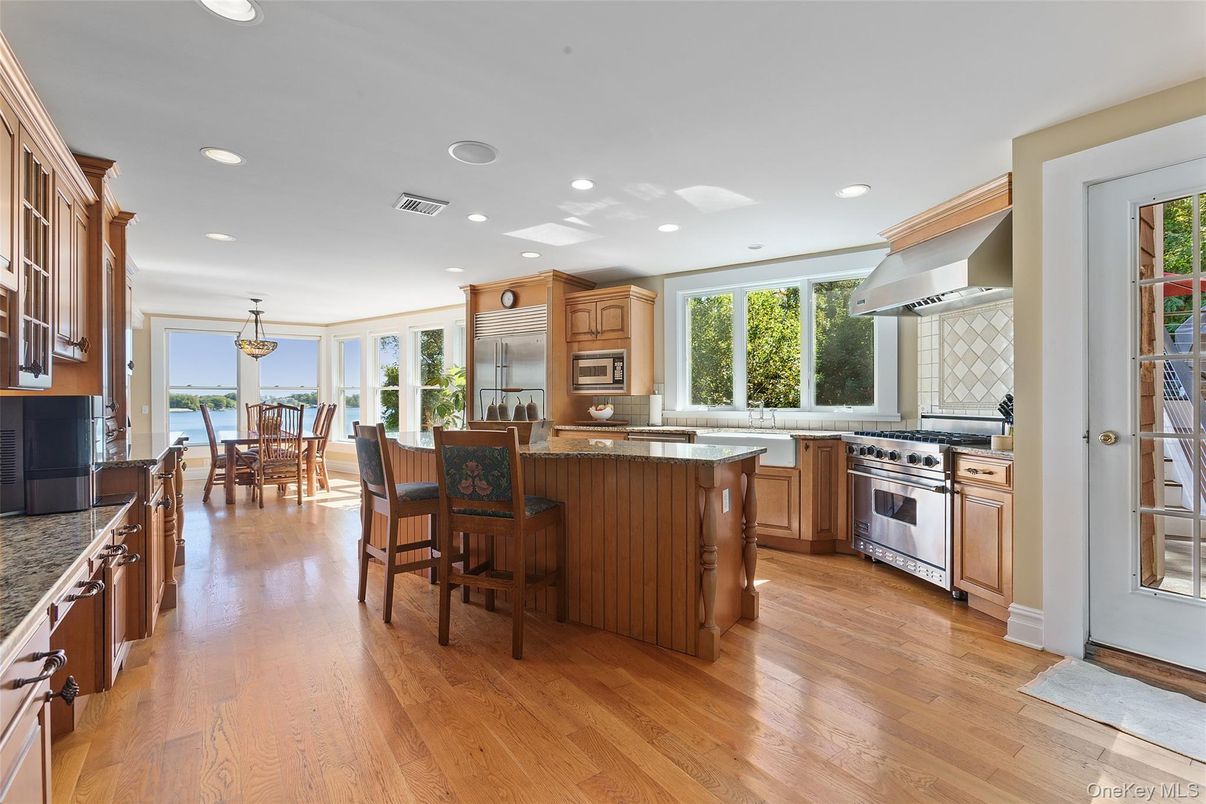Chandelier, Dining room, Interior, Kitchen, Recessed Lighting, Stainless Steel Appliances, Wood Texture Flooring