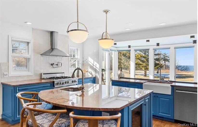 Dining room, Interior, Kitchen, Pendant Lights, Recessed Lighting, Stainless Steel Appliances, Water, Wood Texture Flooring