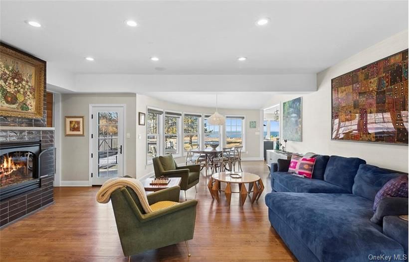 Dining room, Fireplace, Interior, Living room, Pendant Lights, Recessed Lighting, Wood Texture Flooring