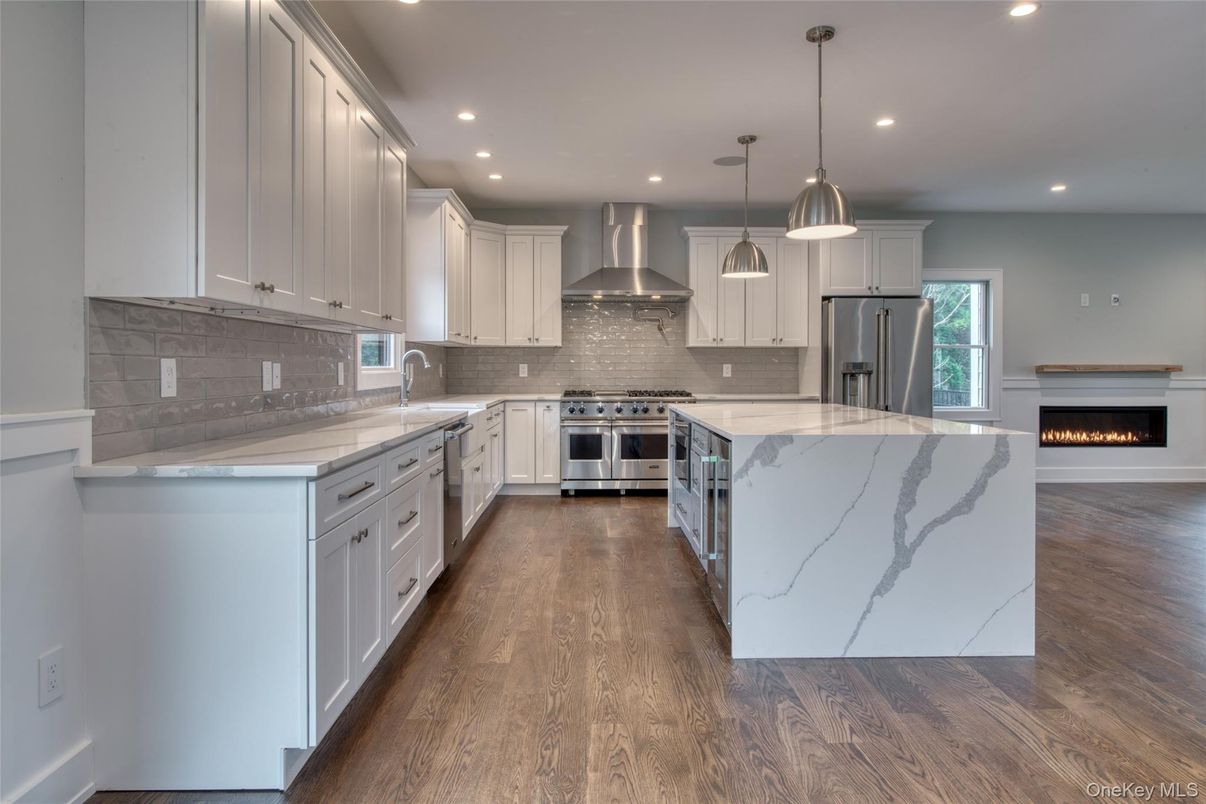 Fireplace, Interior, Kitchen, Pendant Lights, Recessed Lighting, Stainless Steel Appliances, Wood Texture Flooring