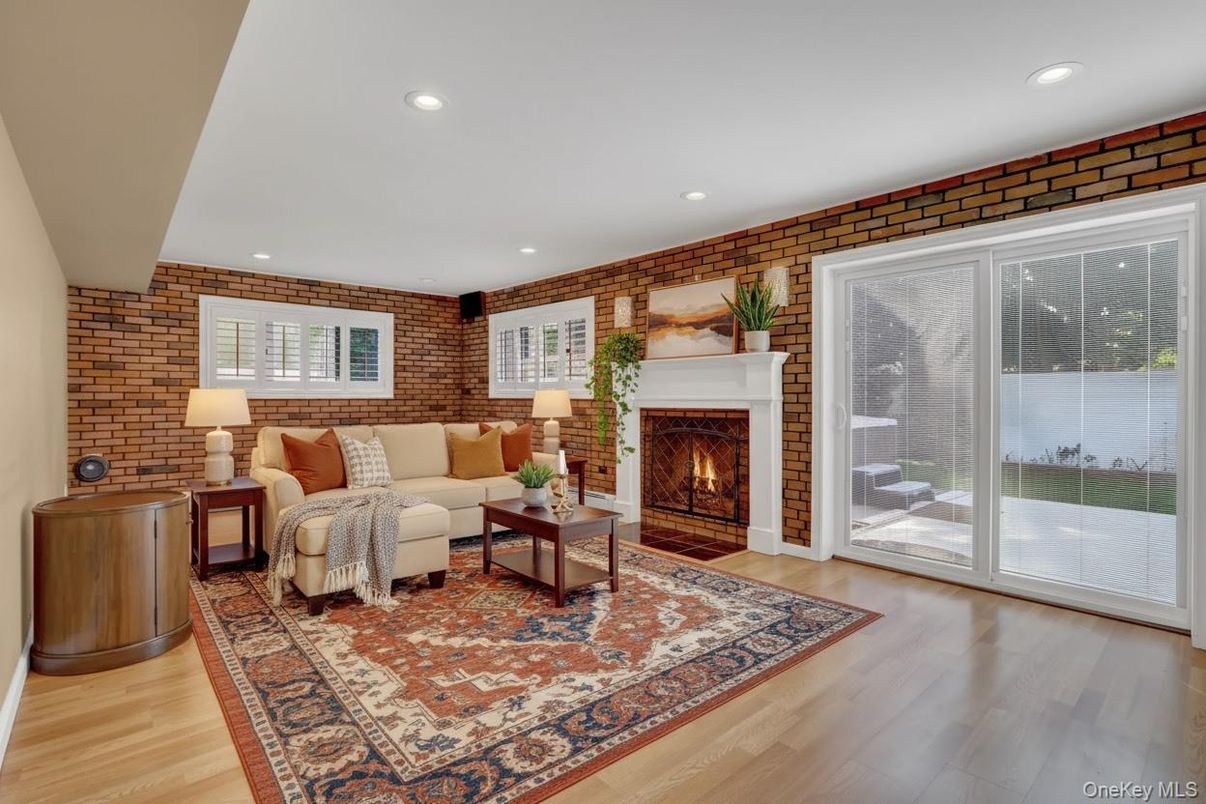 Fireplace, Interior, Living room, Recessed Lighting, Stone Walls, Wood Texture Flooring