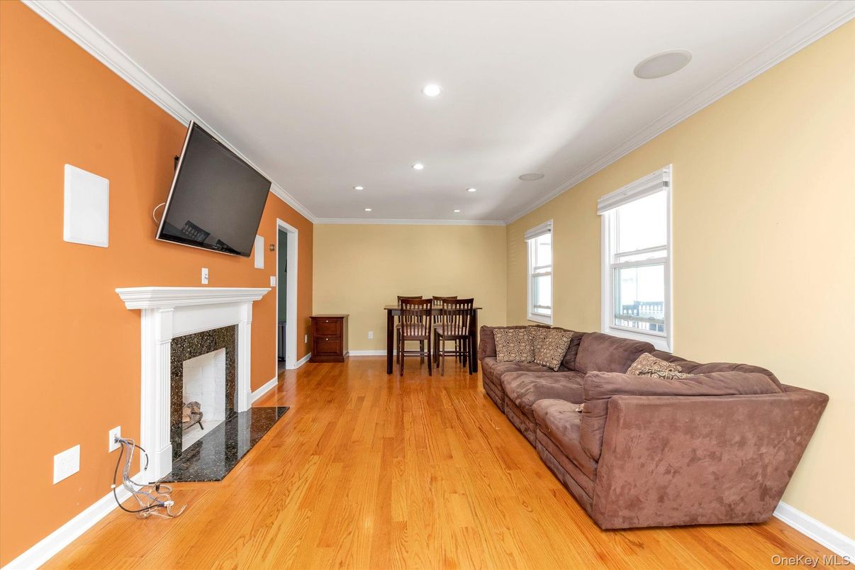 Dining room, Fireplace, Interior, Living room, Recessed Lighting, Wood Texture Flooring