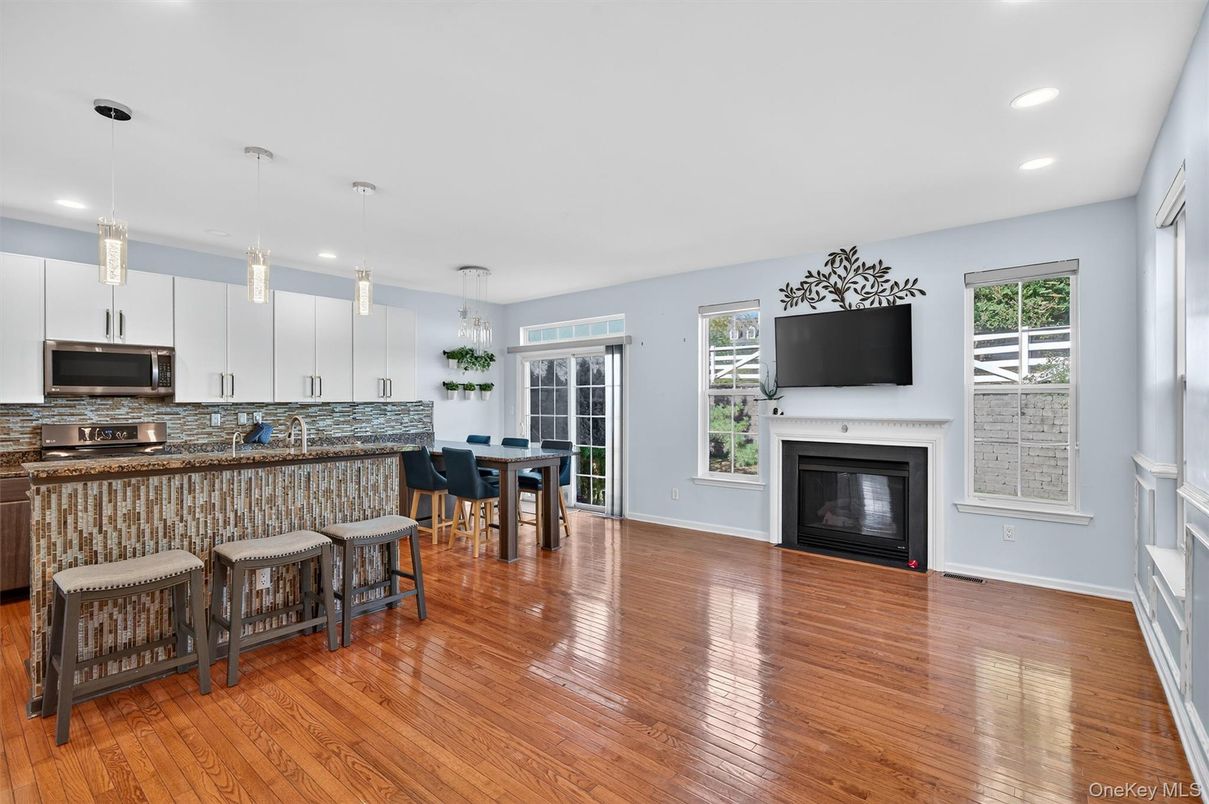Dining room, Fireplace, Interior, Pendant Lights, Recessed Lighting, Wood Texture Flooring