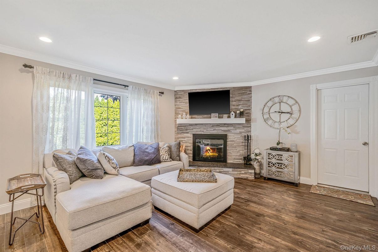 Fireplace, Interior, Living room, Recessed Lighting, Stone Walls, Wood Texture Flooring