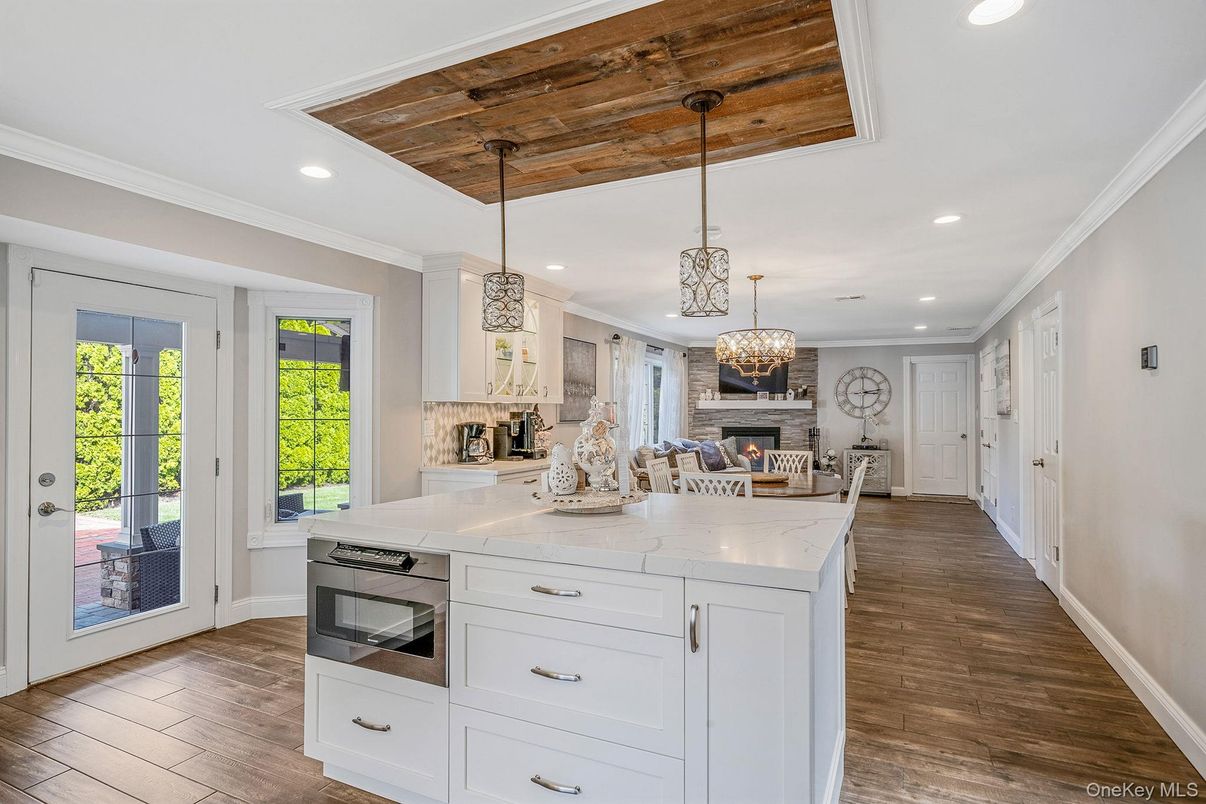 Chandelier, Fireplace, Interior, Kitchen, Pendant Lights, Recessed Lighting, Wooden Ceilings, Wood Texture Flooring