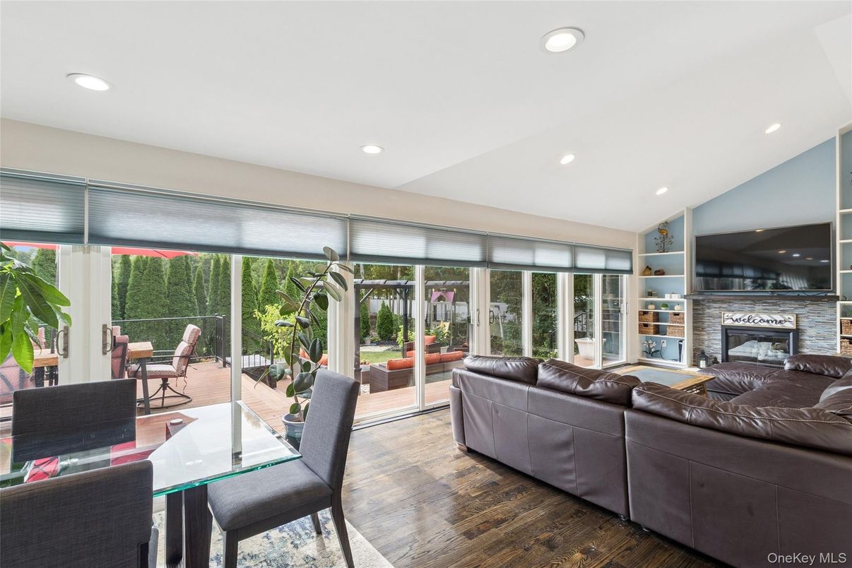 Dining room, Fireplace, Interior, Living room, Recessed Lighting, Wood Texture Flooring