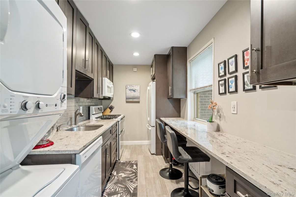 Interior, Kitchen, Recessed Lighting, Washer, Wood Texture Flooring