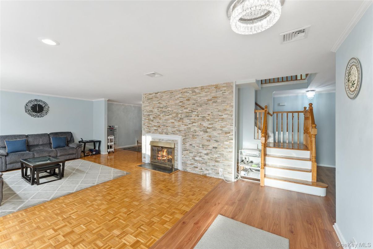 Fireplace, Interior, Living room, Recessed Lighting, Stone Walls, Wood Texture Flooring