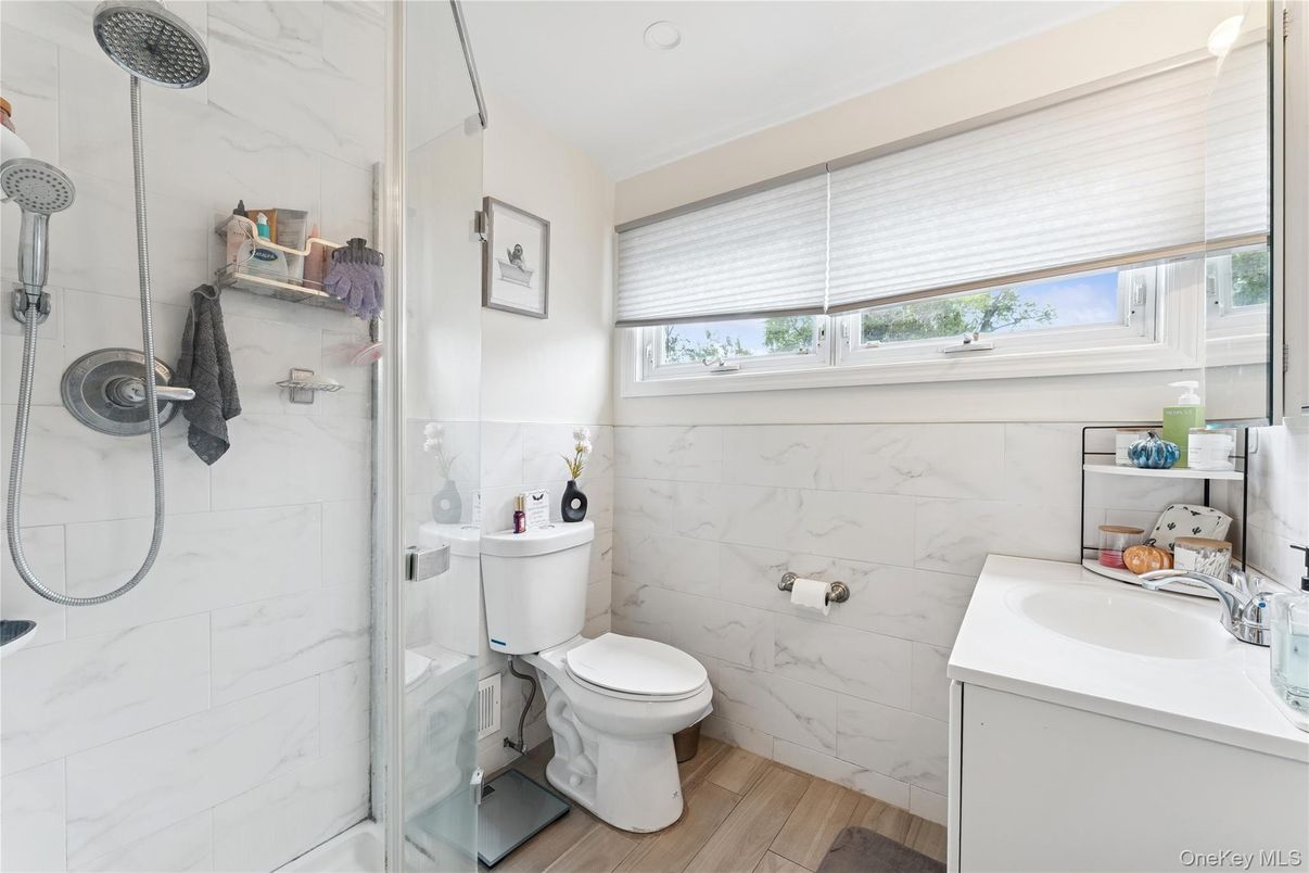 Bathroom, Glass Shower, Interior, Marble Walls, Wood Texture Flooring