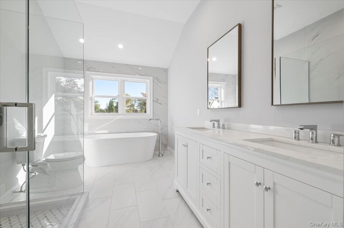 Bathroom, Dual Sink Vanities, Free Standing Baths, Glass Shower, Interior, Marble, Marble Walls, Recessed Lighting