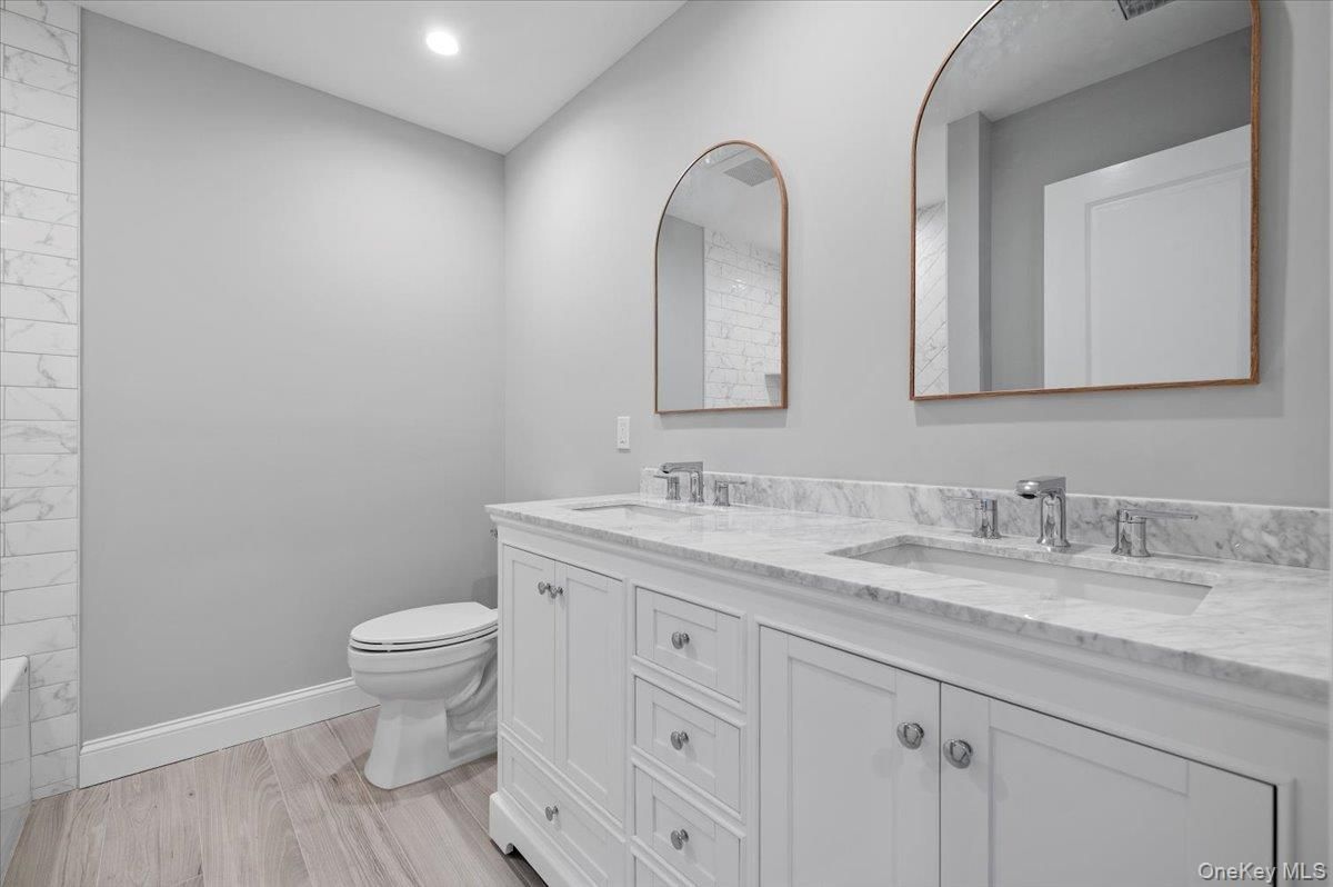 Bathroom, Dual Sink Vanities, Interior, Recessed Lighting, Wood Texture Flooring