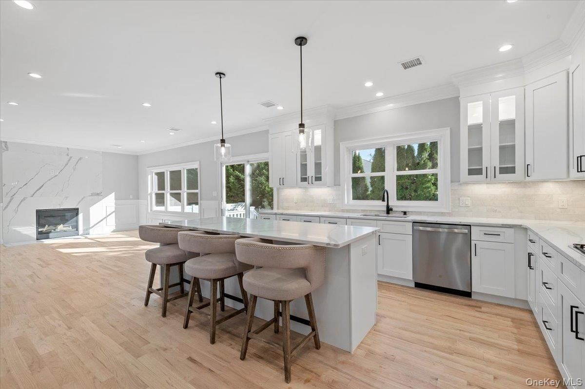 Fireplace, Interior, Kitchen, Pendant Lights, Recessed Lighting, Stainless Steel Appliances, Wood Texture Flooring