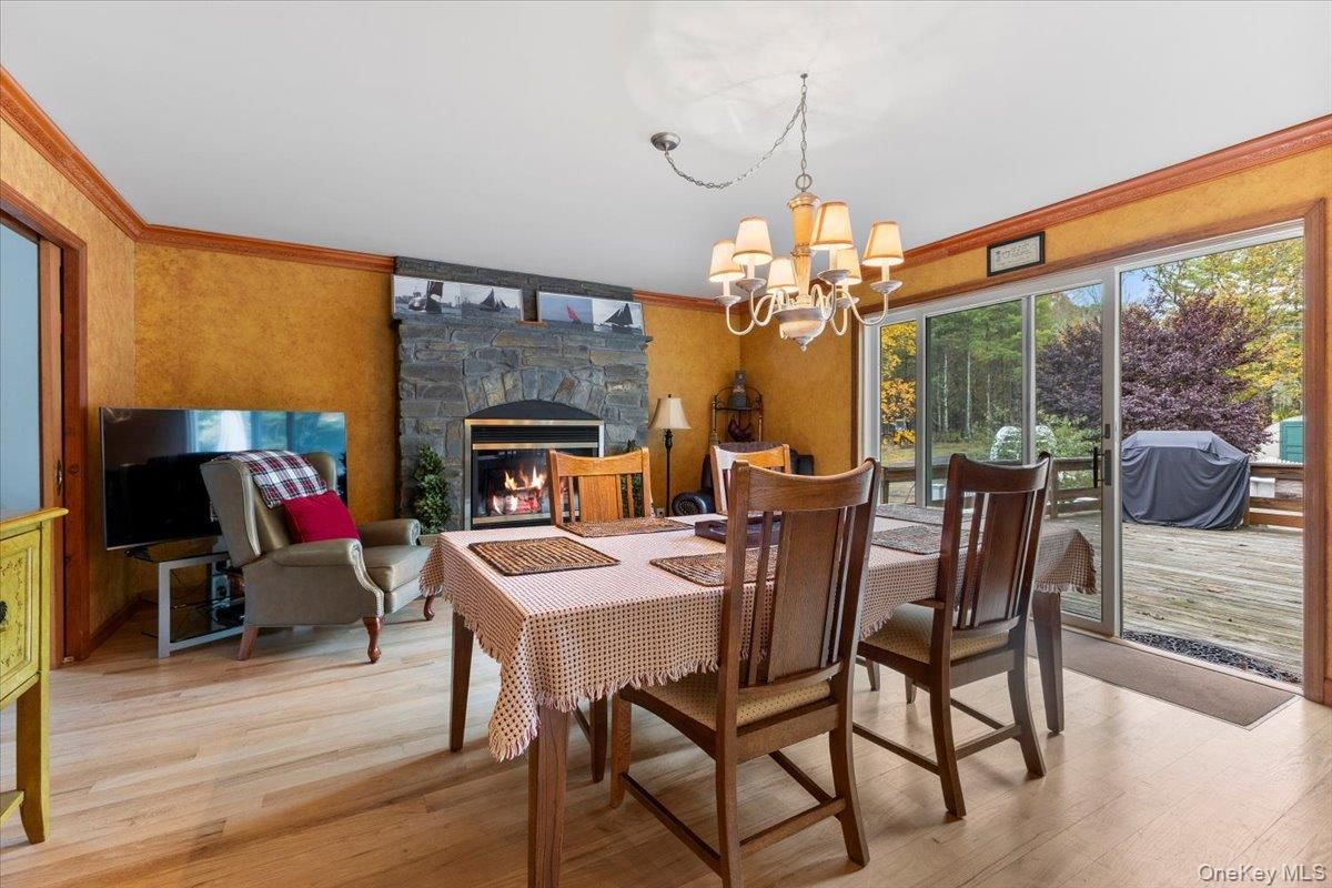 Chandelier, Dining room, Fireplace, Interior, Wood Texture Flooring