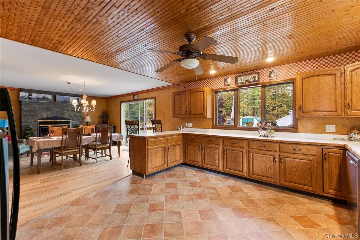 Chandelier, Dining room, Fireplace, Interior, Kitchen, Recessed Lighting, Wooden Ceilings