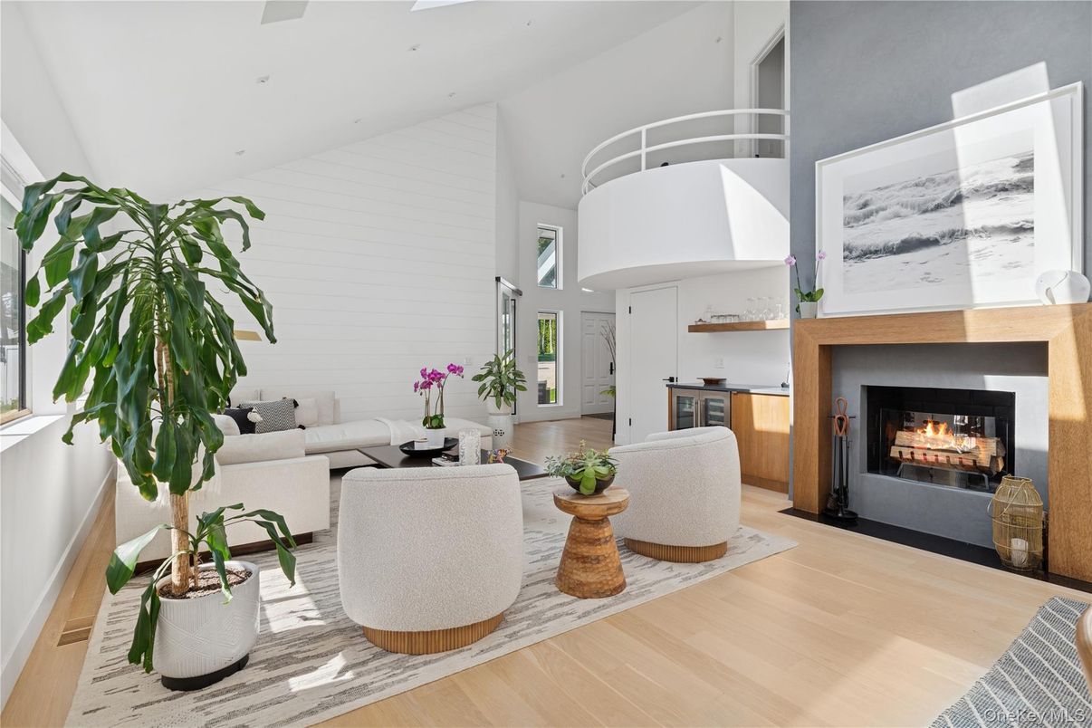 Dining room, Fireplace, Interior, Living room, Recessed Lighting, Wood Texture Flooring