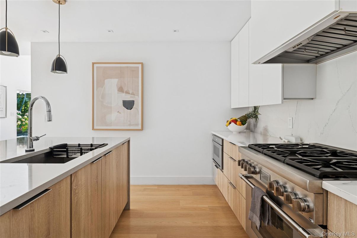 Interior, Kitchen, Marble Walls, Pendant Lights, Recessed Lighting, Stainless Steel Appliances, Wood Texture Flooring