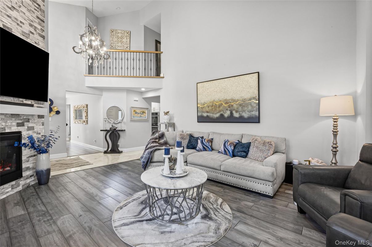 Chandelier, Fireplace, Interior, Living room, Recessed Lighting, Wood Texture Flooring