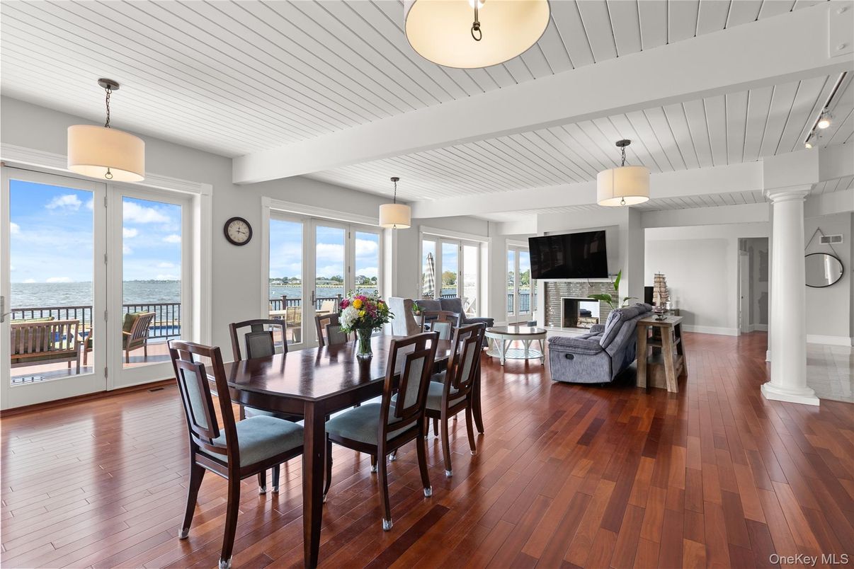 Dining room, Fireplace, Interior, Living room, Pendant Lights, Water, Wood Texture Flooring