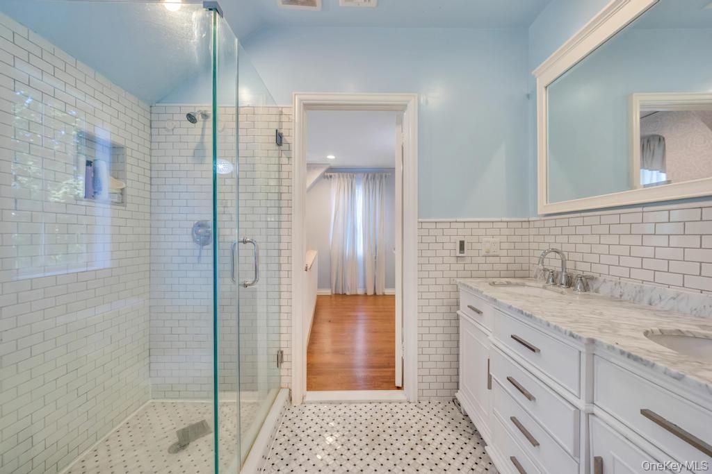Bathroom, Dual Sink Vanities, Glass Shower, Interior, Recessed Lighting, Wood Texture Flooring