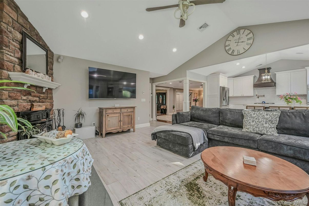 Fireplace, Interior, Kitchen, Living room, Recessed Lighting, Stone Walls, Wood Texture Flooring