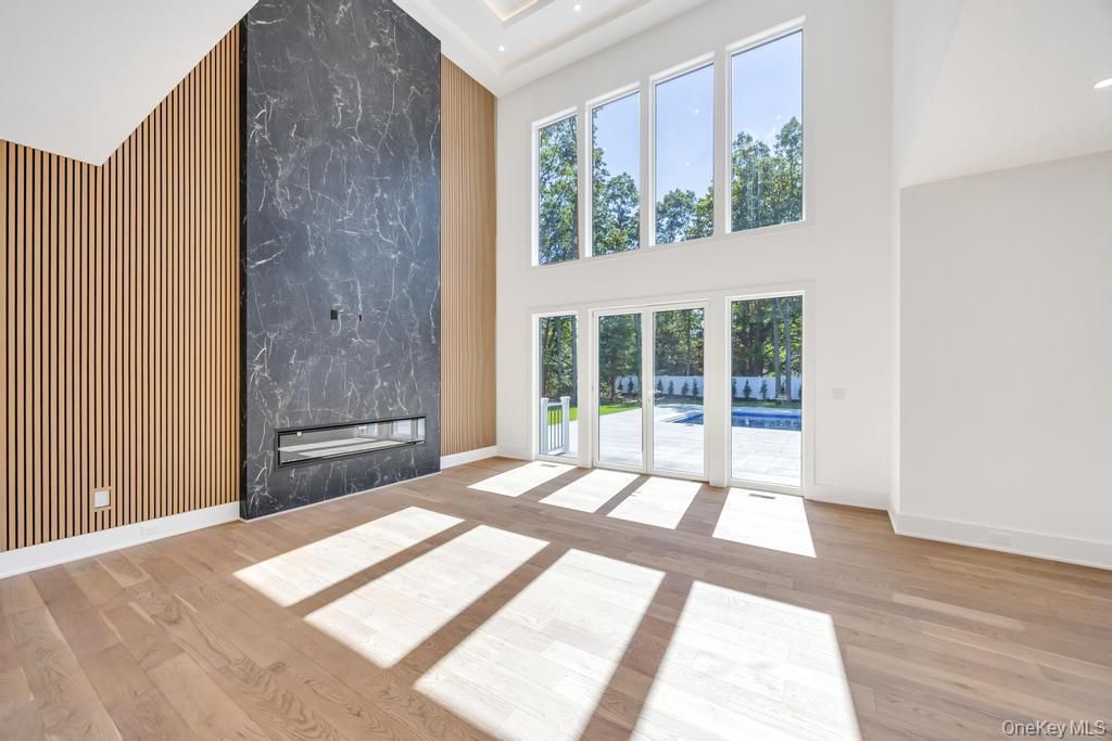 Fireplace, Interior, Marble Walls, Recessed Lighting, Wood Texture Flooring