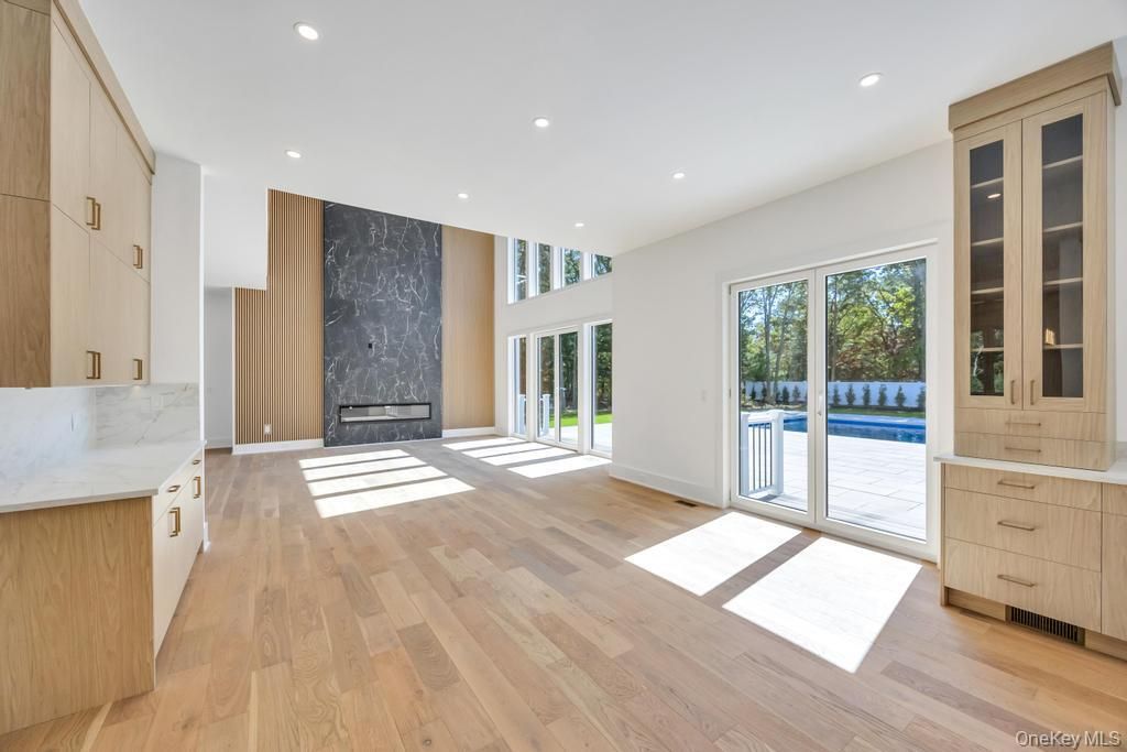 Fireplace, Interior, Kitchen, Marble Walls, Recessed Lighting, Wood Texture Flooring