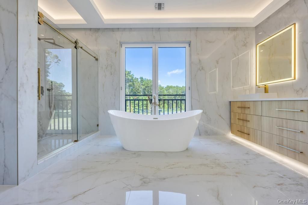 Bathroom, Free Standing Baths, Glass Shower, Interior, Marble, Marble Walls, Recessed Lighting