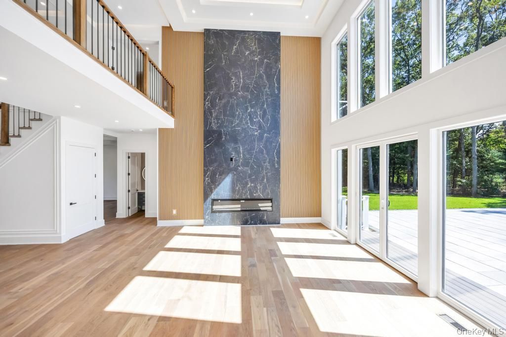 Fireplace, Interior, Marble Walls, Recessed Lighting, Wood Texture Flooring