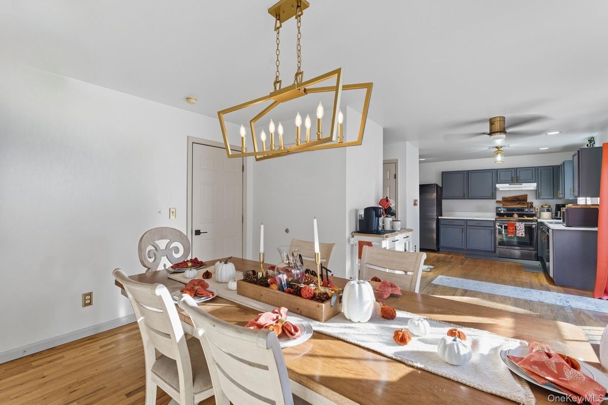 Dining room, Interior, Kitchen, Pendant Lights, Recessed Lighting, Stainless Steel Appliances, Wood Texture Flooring