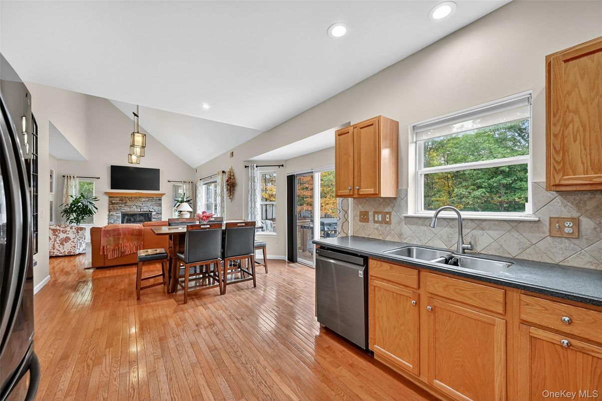 Dining room, Fireplace, Interior, Kitchen, Living room, Pendant Lights, Recessed Lighting, Wood Texture Flooring