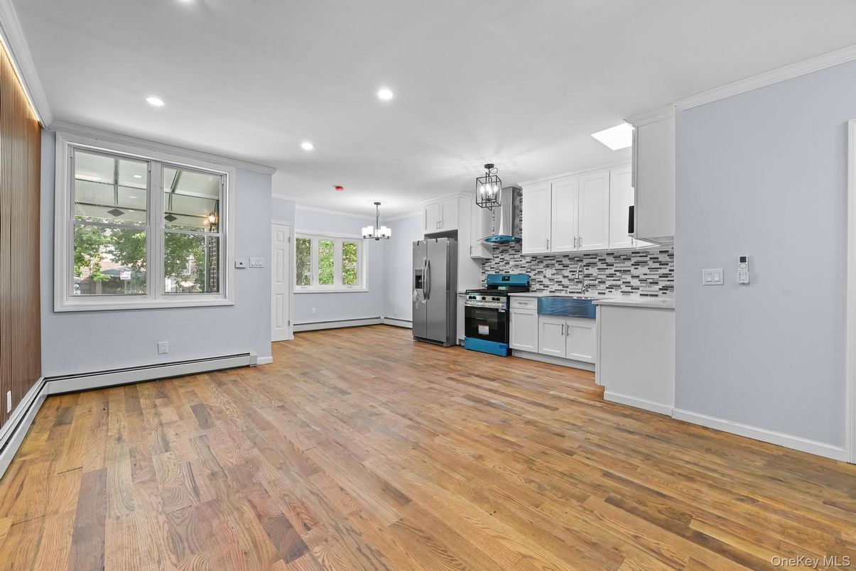 Chandelier, Empty room, Interior, Kitchen, Recessed Lighting, Stainless Steel Appliances, Wood Texture Flooring