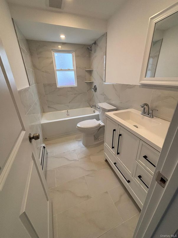 Bathroom, Dual Sink Vanities, Interior, Marble, Marble Walls, Recessed Lighting