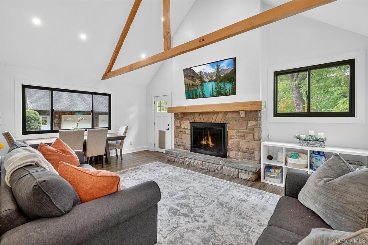 Dining room, Fireplace, Interior, Living room, Recessed Lighting, Wooden Beams, Wood Texture Flooring