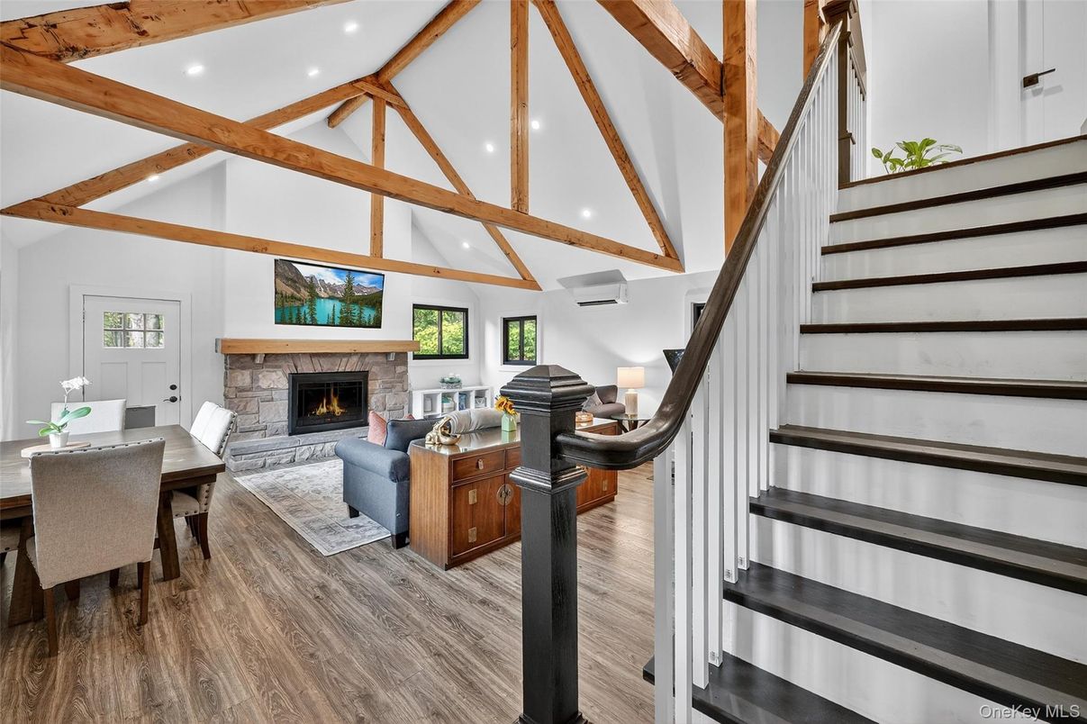 Dining room, Fireplace, Interior, Living room, Recessed Lighting, Wooden Beams, Wood Texture Flooring