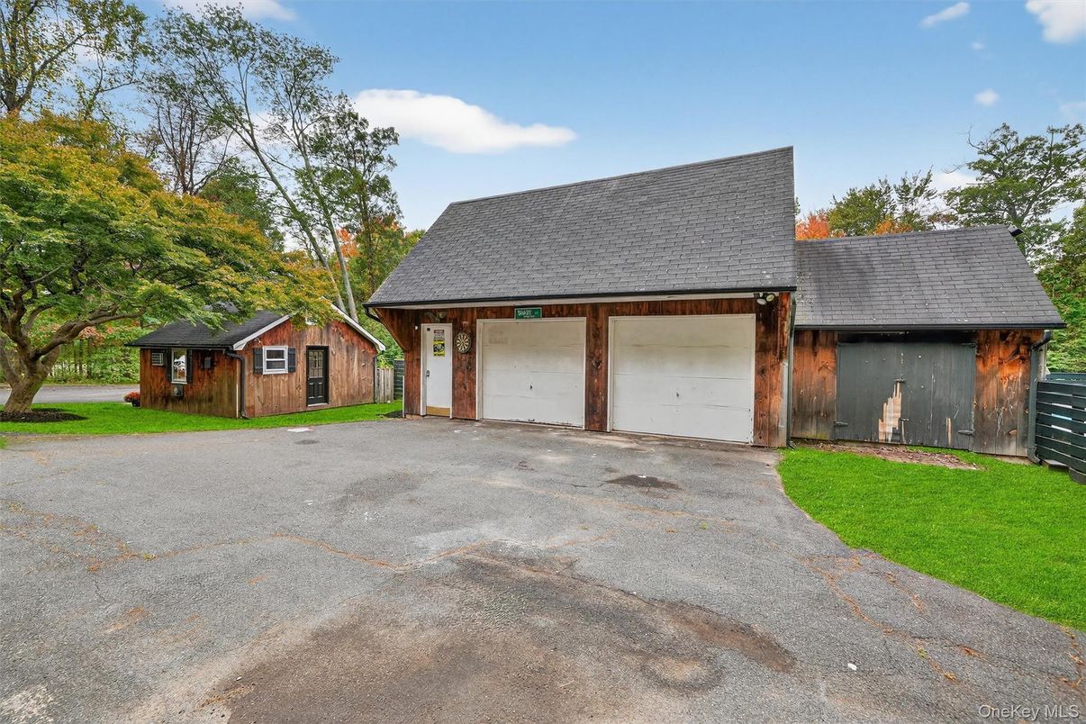 Attached, Backyard, Detached Garage, Exterior, Facade, Brick Facade, Cape Cod