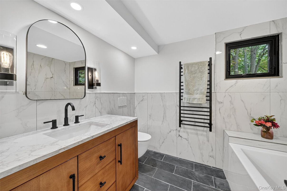 Bathroom, Dual Sink Vanities, Interior, Marble, Marble Walls, Recessed Lighting