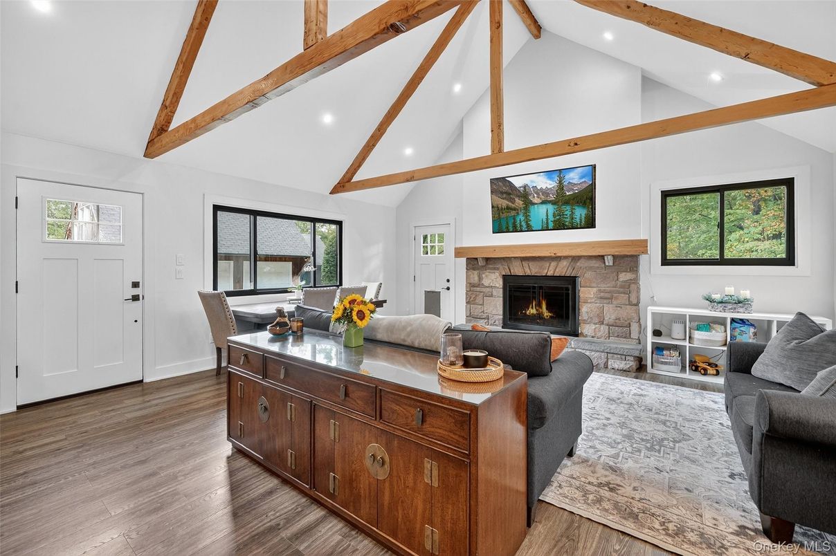 Dining room, Fireplace, Interior, Living room, Recessed Lighting, Wooden Beams, Wood Texture Flooring