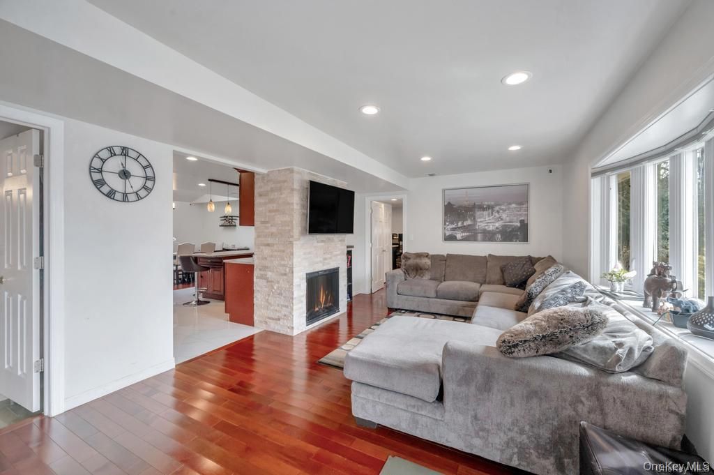 Dining room, Fireplace, Interior, Living room, Pendant Lights, Recessed Lighting, Wood Texture Flooring
