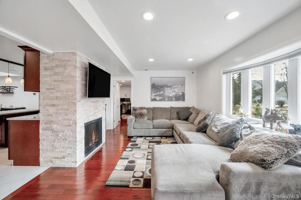 Fireplace, Interior, Living room, Pendant Lights, Recessed Lighting, Stone Walls, Wood Texture Flooring