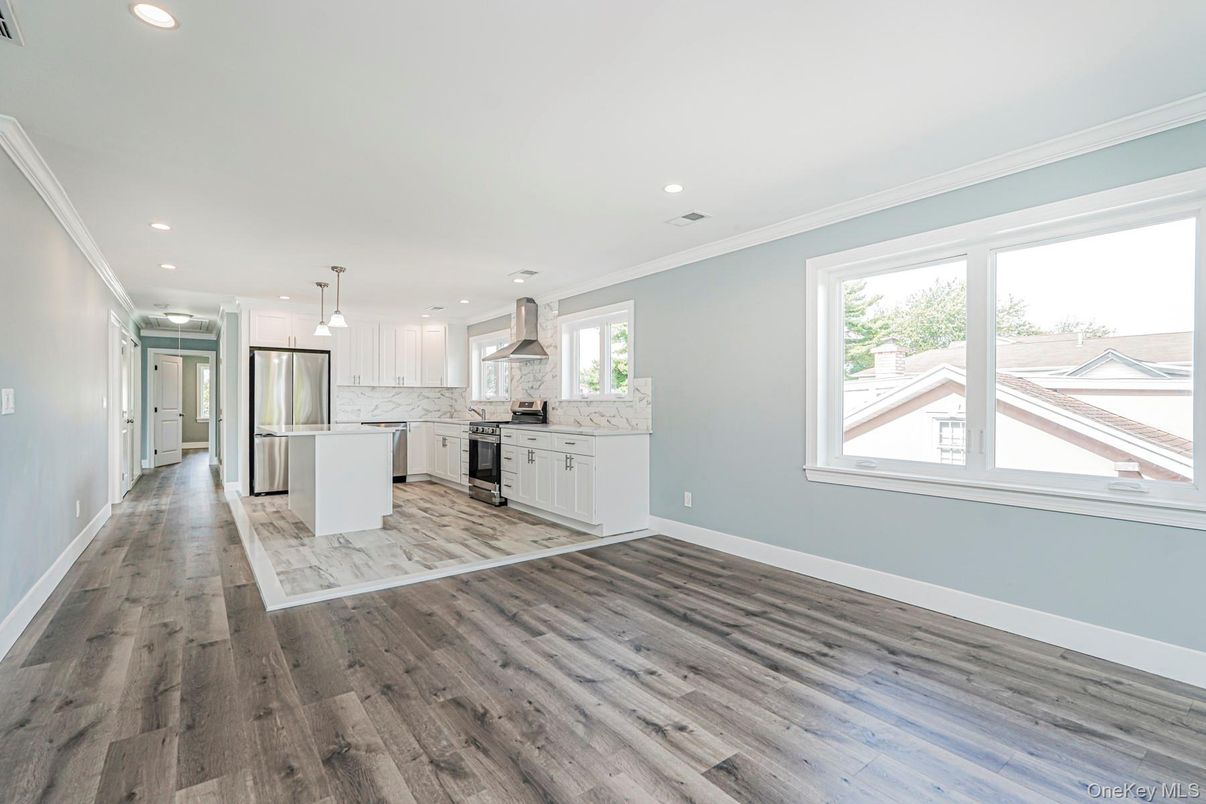 Interior, Kitchen, Marble Walls, Pendant Lights, Recessed Lighting, Stainless Steel Appliances, Wood Texture Flooring