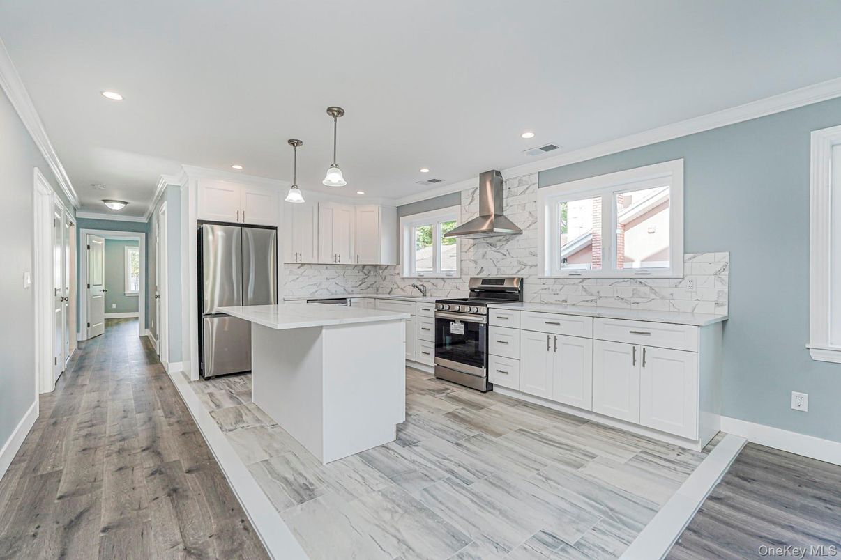 Interior, Kitchen, Marble Walls, Pendant Lights, Recessed Lighting, Stainless Steel Appliances, Wood Texture Flooring