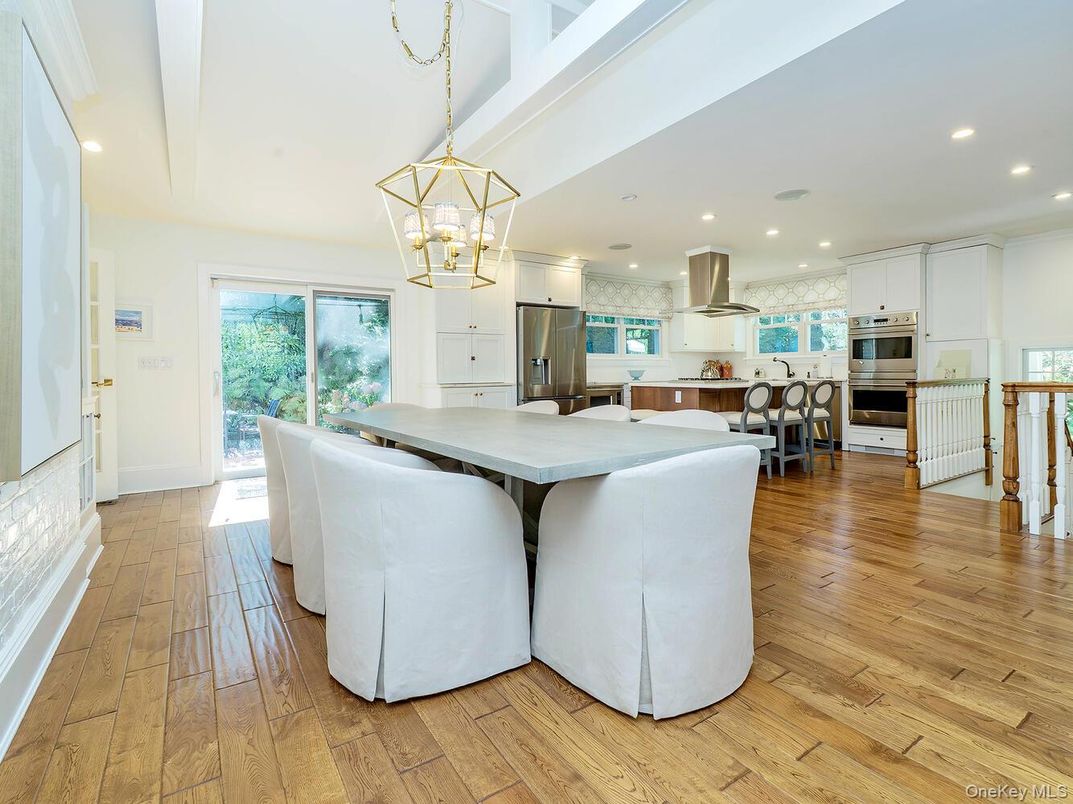 Chandelier, Dining room, Interior, Kitchen, Pendant Lights, Recessed Lighting, Stainless Steel Appliances, Wood Texture Flooring